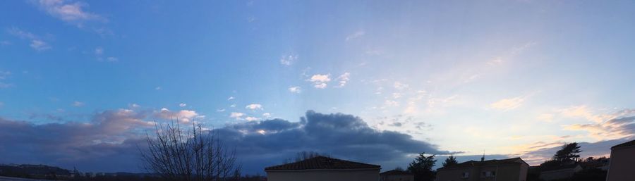 Low angle view of cloudy sky at sunset