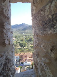 Houses on mountain against clear sky