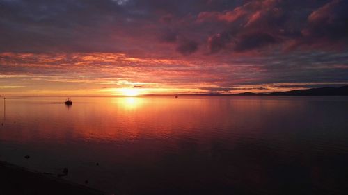 View of calm sea at sunset