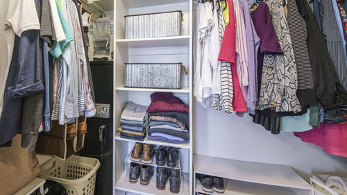 Clothes hanging in row at store