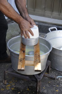 Low section of man preparing food