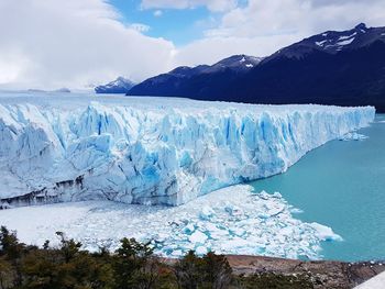 Scenic view of glacier on sea