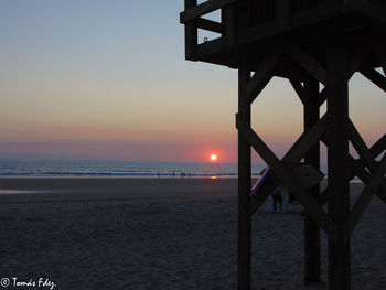 View of beach at sunset