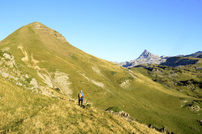 Scenic view of mountains against clear blue sky