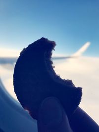 Low angle view of silhouette rock against sky