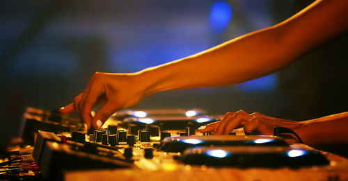 Dj mixing sound at nightclub