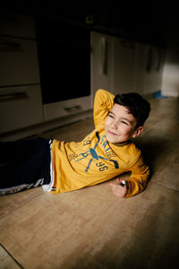 Happy smiling boy lying on the floor. high quality photo