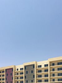 Low angle view of residential buildings against clear sky