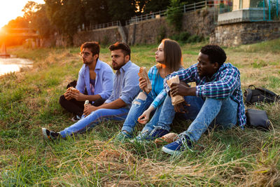 Young couple sitting on grassland