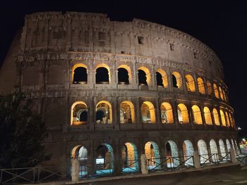 Low angle view of historical building at night