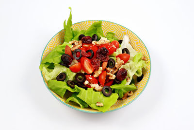 Salad in bowl against white background