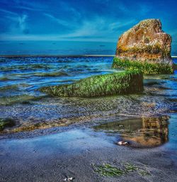 Scenic view of beach against sky