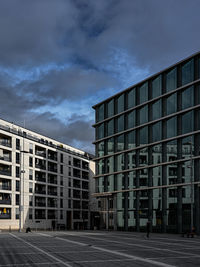 Low angle view of modern buildings against sky