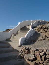 Rocks against clear blue sky