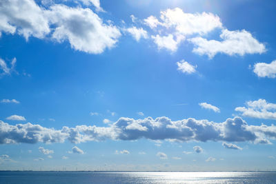 Scenic view of sea against blue sky