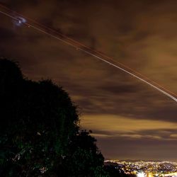 Scenic view of landscape against sky at night