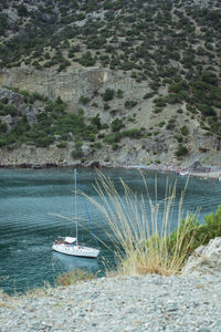 High angle view of sailboats moored on sea