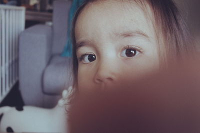 Close-up portrait of cute baby at home