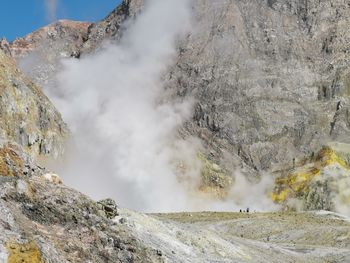 Smoke emitting from volcanic mountain