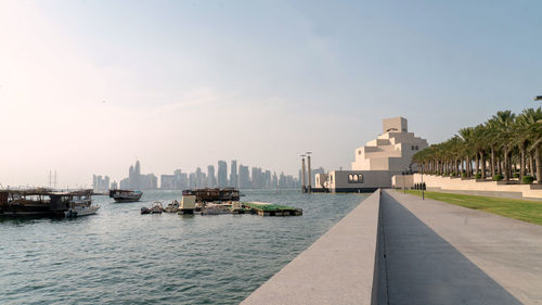Doha skyline and museum of islamic art against clear sky