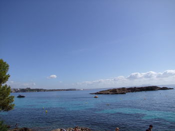 Scenic view of sea against blue sky