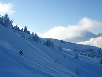 Scenic view of snowcapped mountain against sky