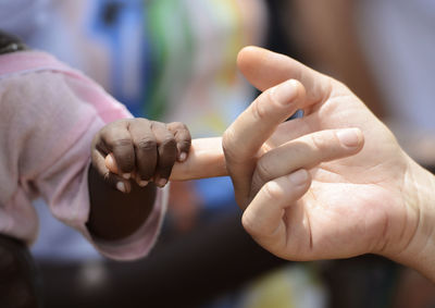 Close-up of person holding hands