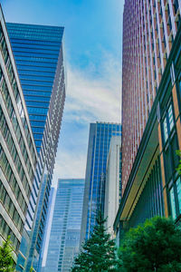 Low angle view of skyscrapers against sky