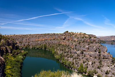 Scenic view of lake against blue sky