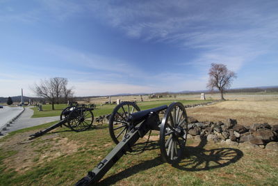 Bicycle on field against sky