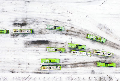 Aerial view of buses on snow covered road