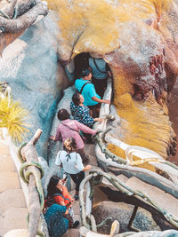 High angle view of people on rock