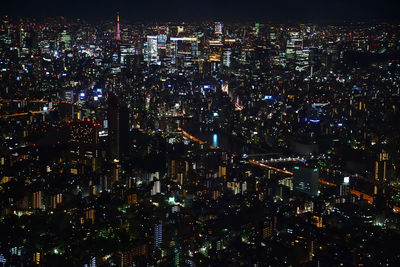 Aerial view of illuminated cityscape at night