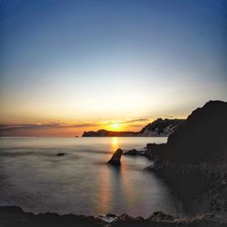 Scenic view of sea against sky during sunset