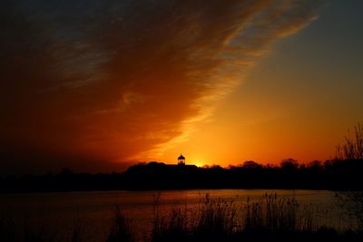 Scenic view of lake at sunset