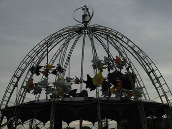 Low angle view of ferris wheel against sky