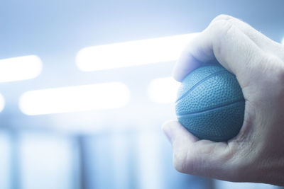 Close-up of hand holding ball 