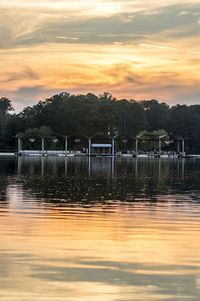 Scenic view of lake at sunset