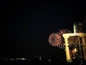 Low angle view of illuminated ferris wheel