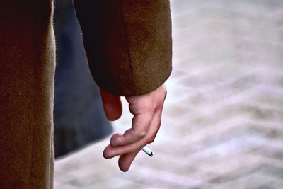 Low section of person holding hands
