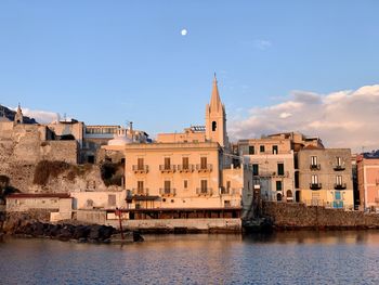 View of buildings against blue sky