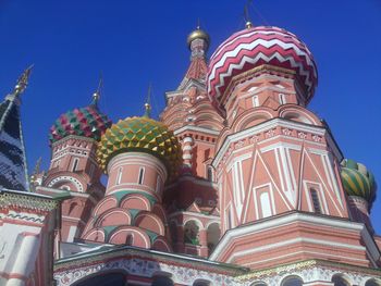 Low angle view of st basil cathedral at red square against blue sky