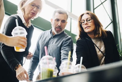 Business coworkers having drinks at conference