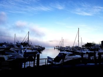 Boats moored at harbor