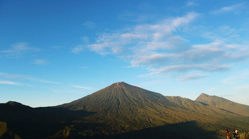 View of volcanic landscape against sky