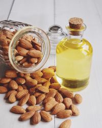 Close-up of almond with oil on table