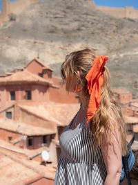 Rear view of woman with dog