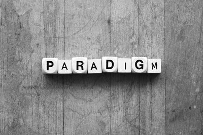 "paradigm" - embossed cube letters