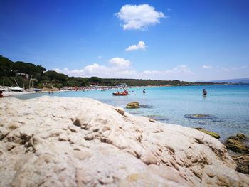 Scenic view of beach against blue sky