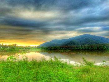 Scenic view of mountains against cloudy sky